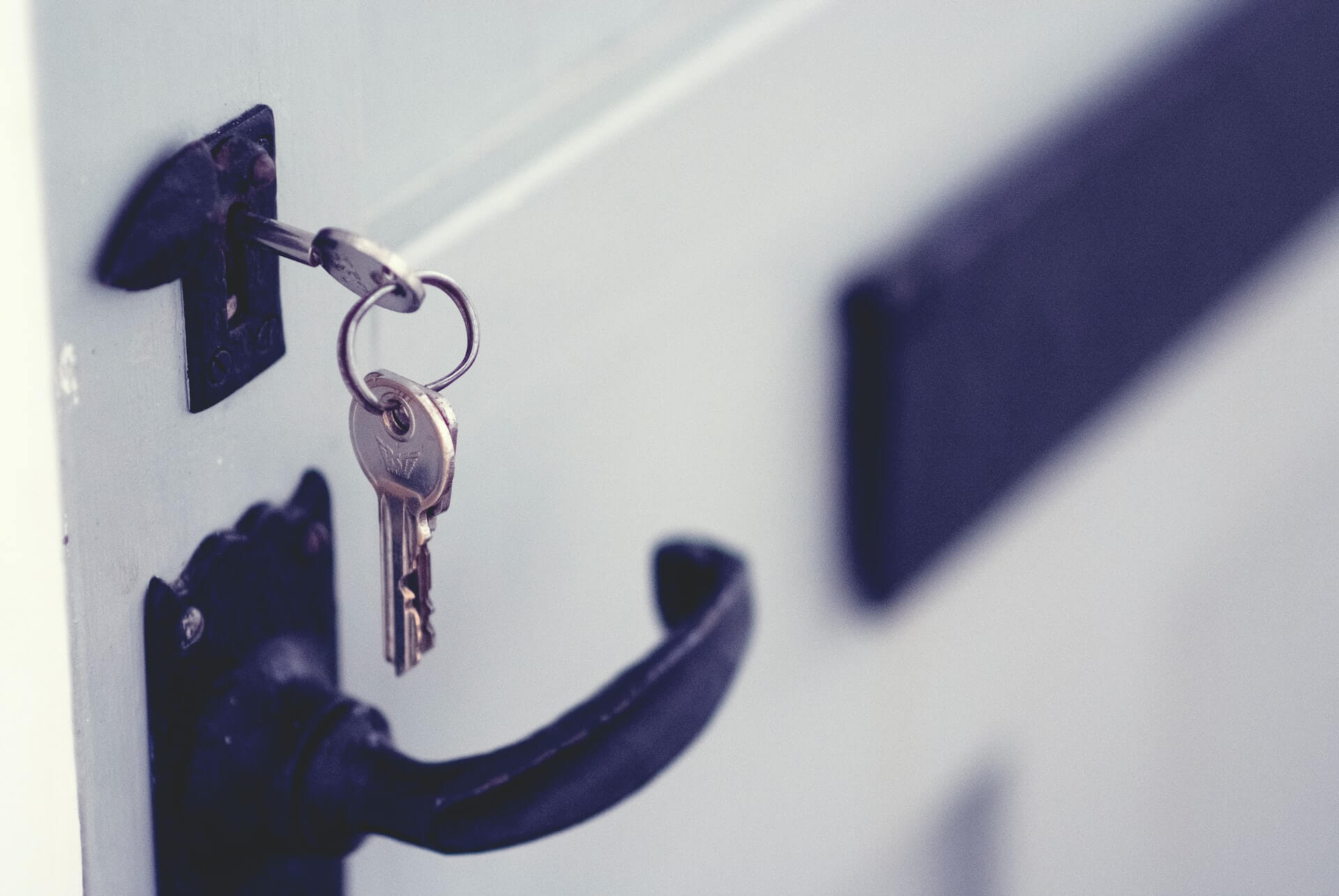 A close up of keys in a door lock